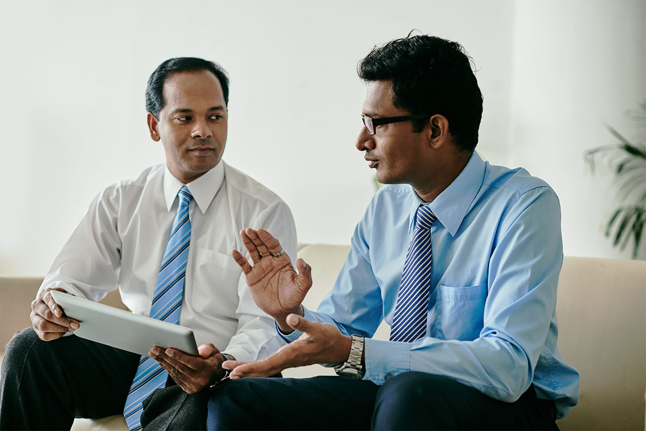 Indians discussing how to register a company in Singapore